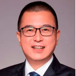 A person wearing glasses Description automatically generated with low confidence