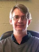 A person wearing glasses Description automatically generated with medium confidence