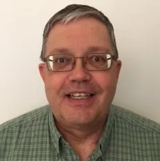 A person wearing glasses Description automatically generated with medium confidence