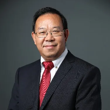 A person wearing a suit and tie Description automatically generated with medium confidence